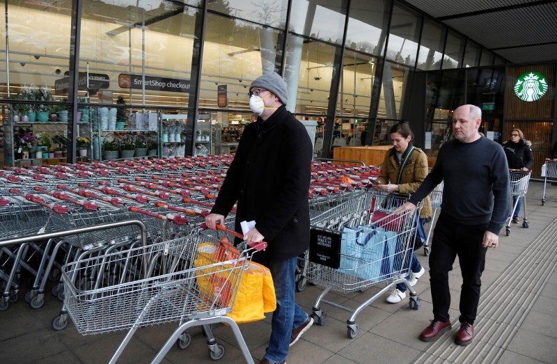 &copy; Reuters. Shoppers queue to enter a Sainsbury&apos;s supermarket in West London