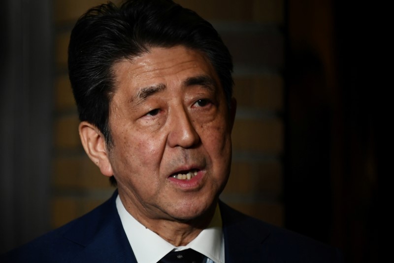 &copy; Reuters. Japan&apos;s Prime Minister Shinzo Abe talks to the journalists in front of the prime minister&apos;s residence in Tokyo