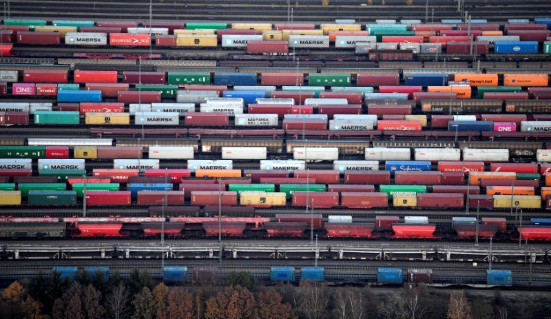 &copy; Reuters. Containers are loaded on freight trains at the railroad shunting yard in Maschen near Hamburg
