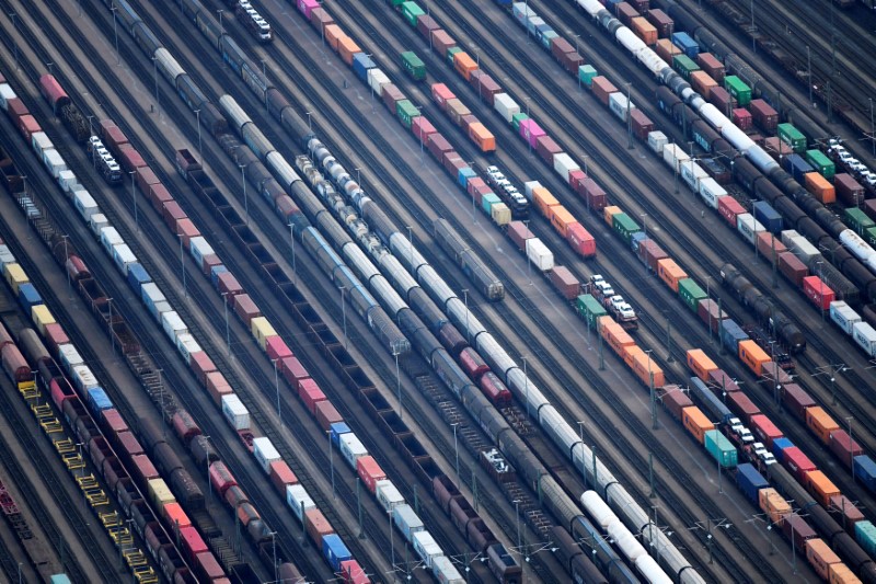 &copy; Reuters. Containers are loaded on freight trains at the railroad shunting yard in Maschen near Hamburg