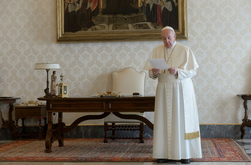 &copy; Reuters. Pope Francis recites the &quot;Our Father&quot; from a library inside the Vatican