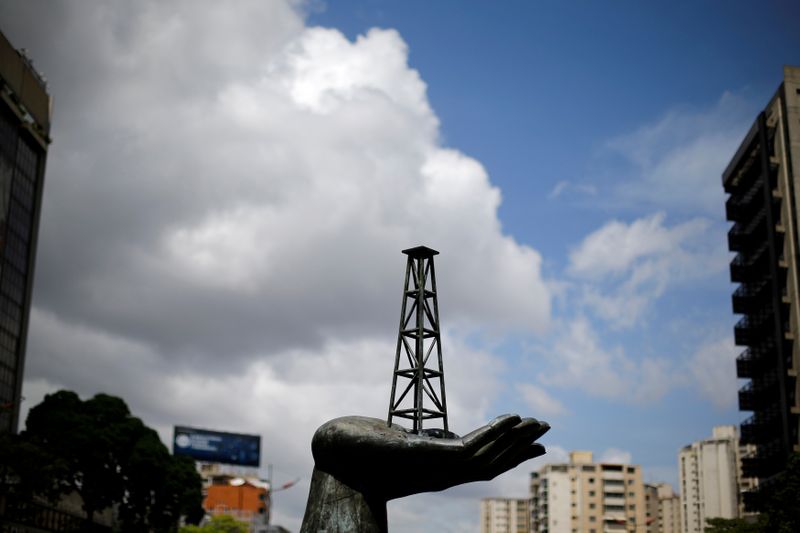 © Reuters. FILE PHOTO: A sculpture is seen outside a building of Venezuela's state oil company PDVSA in Caracas