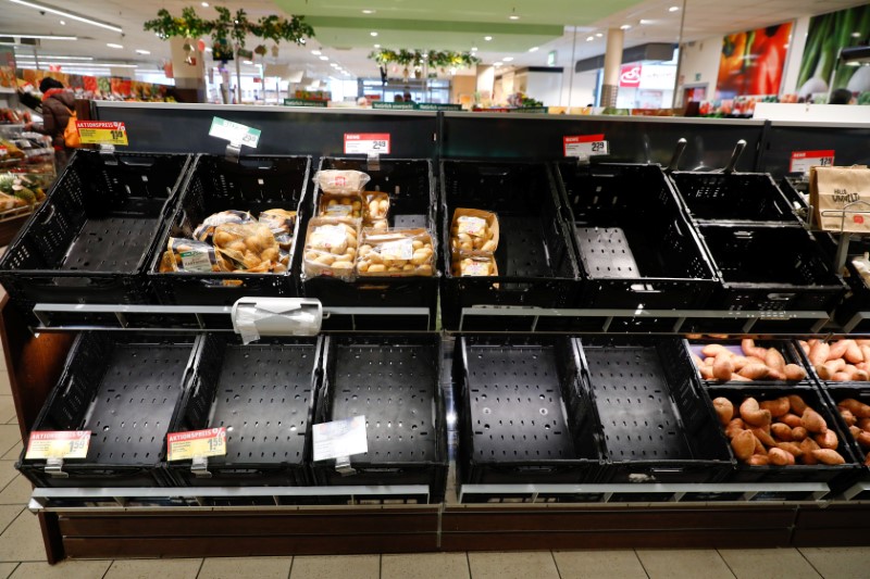 &copy; Reuters. Partially emptied shelves are pictured at a Rewe grocery store in Potsdam