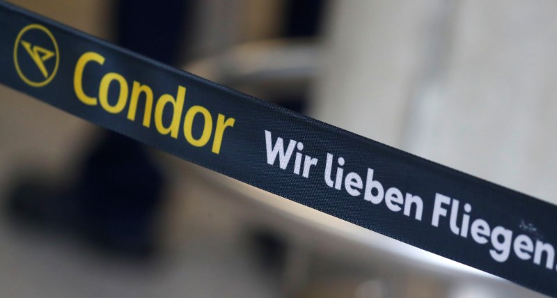 &copy; Reuters. A banner reding &quot;Condor we love flying&quot; is seen next to a check-in counter of airline Condor at the airport  in Frankfurt