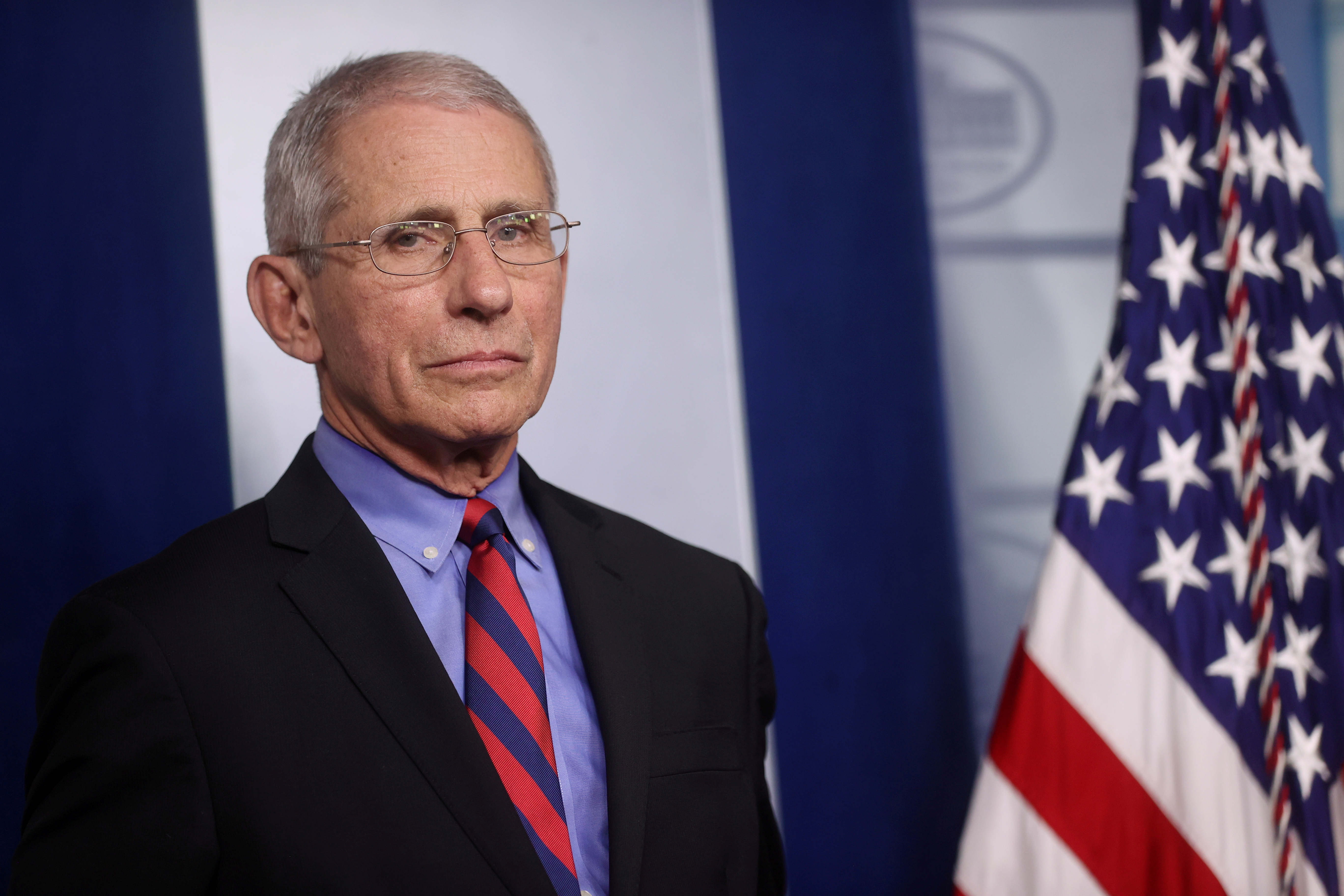 &copy; Reuters. FILE PHOTO: Dr. Anthony Fauci listens to daily coronavirus briefing at the White House in Washington