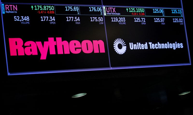 &copy; Reuters. A screen shows the logos and trading information for defense contractor Raytheon Co, and United Technologies Corp. on the floor at the NYSE in New York