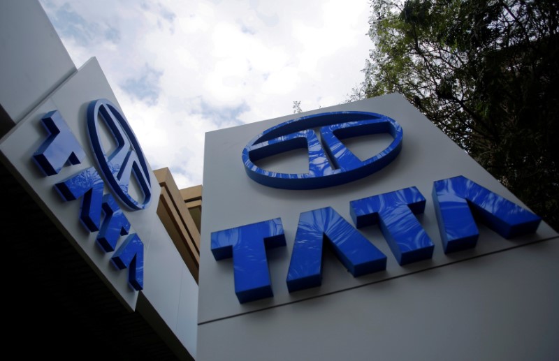 &copy; Reuters. FILE PHOTO: Tata Motors logos are seen at their flagship showroom before the announcement of their Q3 results in Mumbai