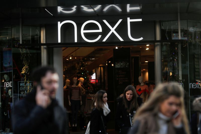 &copy; Reuters. FILE PHOTO: Shoppers walk past a Next store on Oxford Street in London