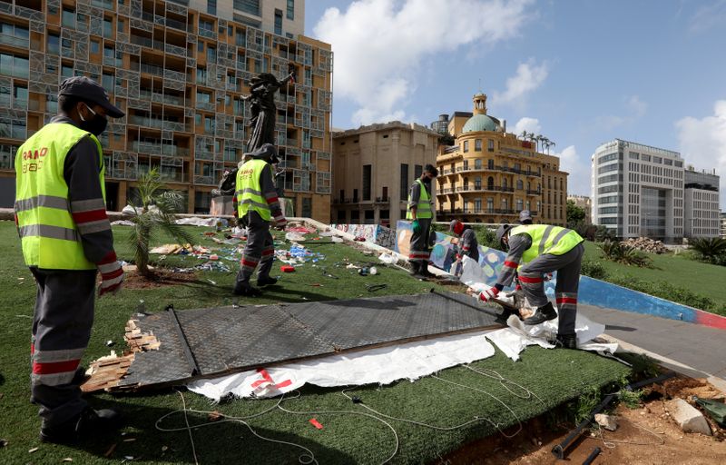 &copy; Reuters. Workers clean the area around Martyrs&apos; Square in Beirut