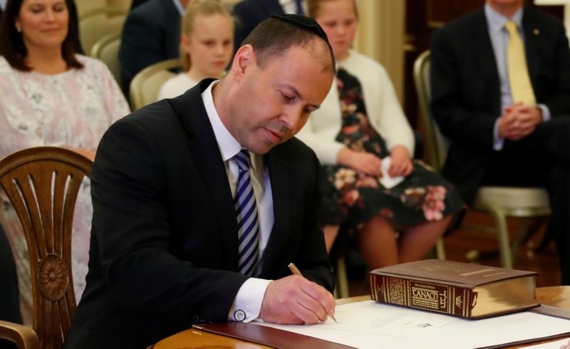 &copy; Reuters. The new Treasurer Josh Frydenberg attends the swearing-in ceremony in Canberra