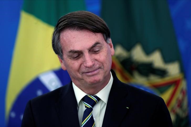 &copy; Reuters. Brazil&apos;s President Bolsonaro smiles at a media statement in Brasilia