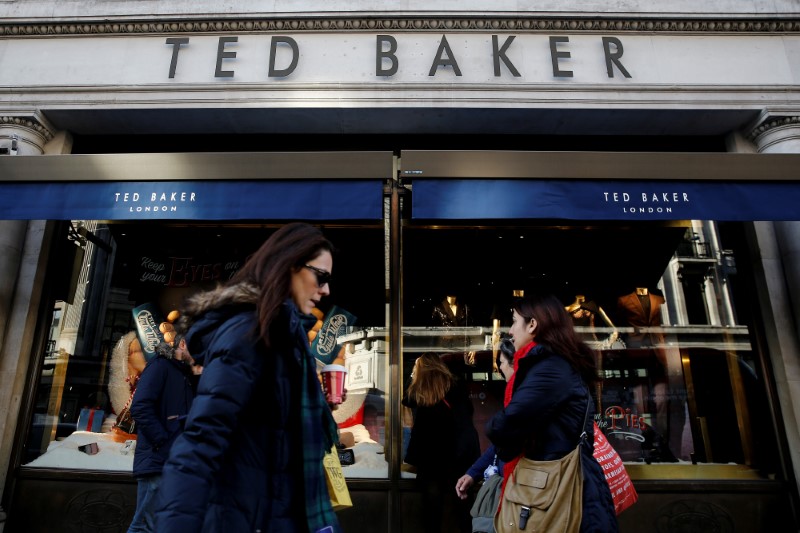 &copy; Reuters. Shoppers walk past a Ted Baker store on Regents Street in London