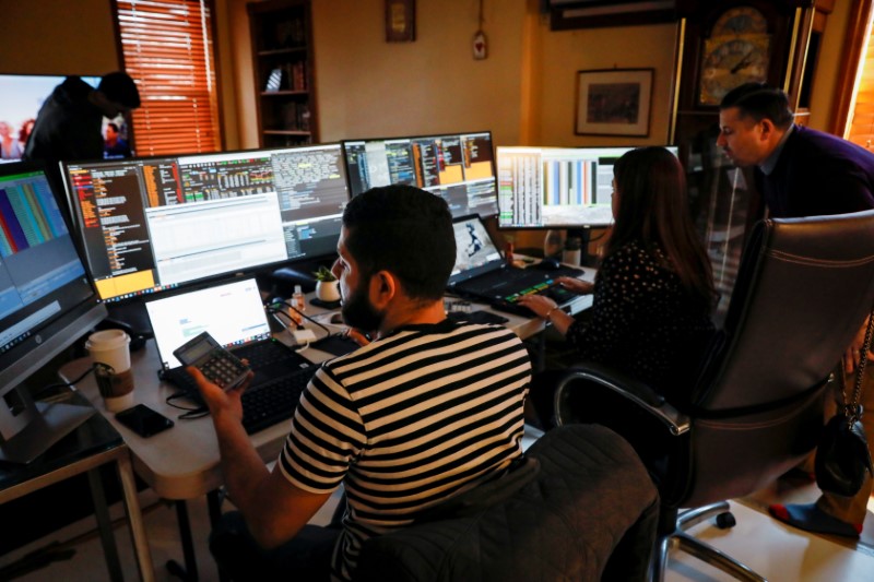 &copy; Reuters. NYSE-AMEX Options floor traders from TradeMas Inc. work in an off-site trading office  due to the outbreak of the coronavirus disease (COVID-19), in New York