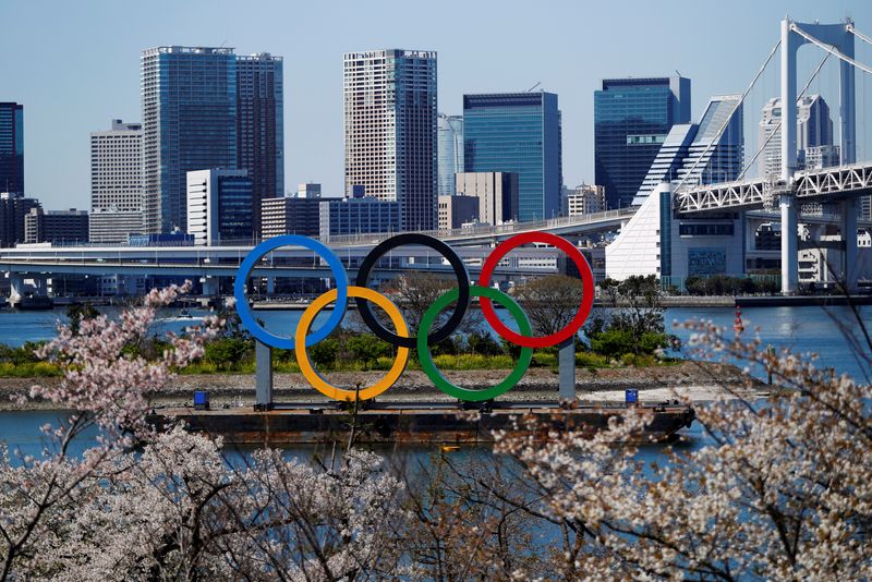© Reuters. FILE PHOTO: Giant Olympic rings are seen at the waterfront area at Odaiba Marine Park in Tokyo, Japan