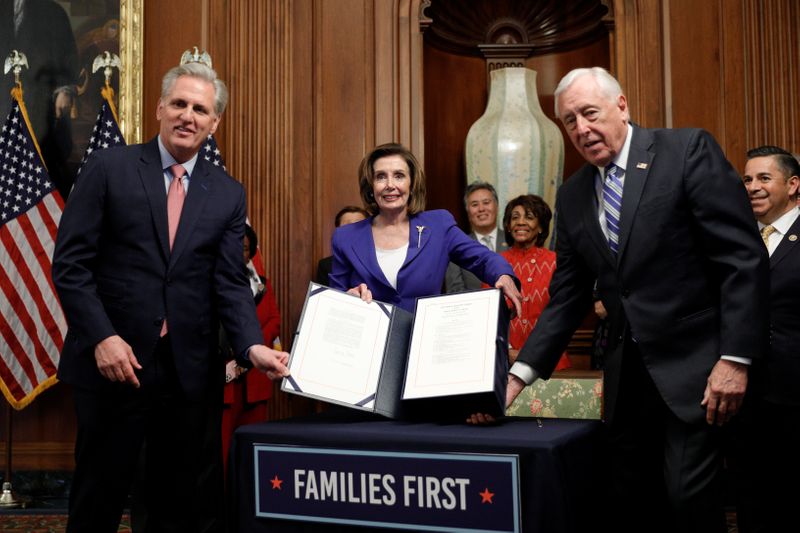 &copy; Reuters. House Speaker Pelosi holds coronavirus aid bill signing ceremony at the U.S. Capitol in Washington