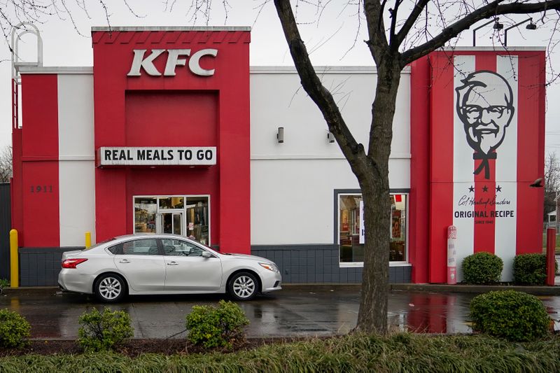 &copy; Reuters. A vehicle waits at the drive-thru window of Kentucky Fried Chicken after a state mandated carry-out only policy went into effect in order to slow the spread of the novel coronavirus (COVID-19) in Louisville