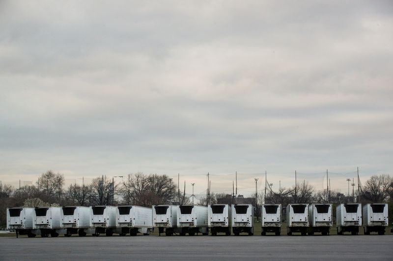 &copy; Reuters. Refrigerated tractor trailers that can be used by hospitals for make shift morgues are seen, during the coronavirus disease (COVID-19) outbreak, in Icahn Stadium parking lot on Randall&apos;s Island in New York
