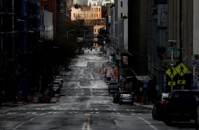 &copy; Reuters. A mostly empty Western Avenue near Pike Place Market during the coronavirus disease (COVID-19) outbreak in Seattle