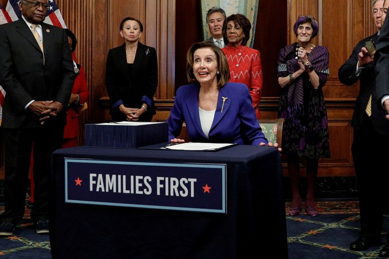 &copy; Reuters. FILE PHOTO: House Speaker Pelosi holds coronavirus aid bill signing ceremony at the U.S. Capitol in Washington