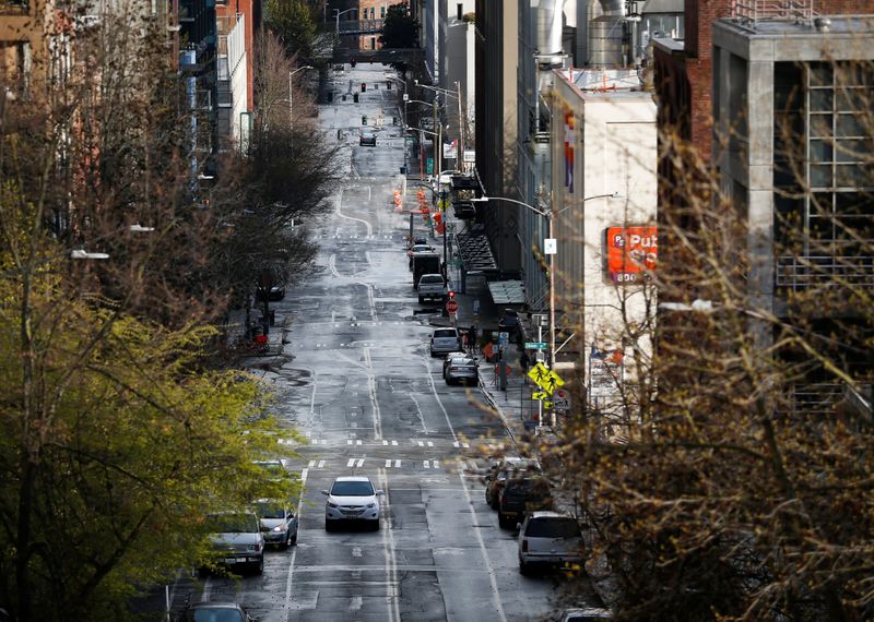 &copy; Reuters. A mostly empty Western Avenue near Pike Place Market during the coronavirus disease (COVID-19) outbreak in Seattle