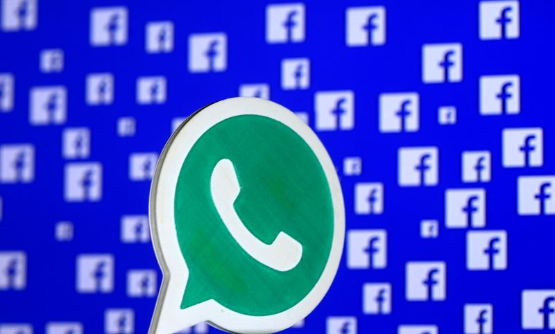 &copy; Reuters. A 3D printed Whatsapp  logo is seen in front of a displayed Facebook logo in this illustration taken
