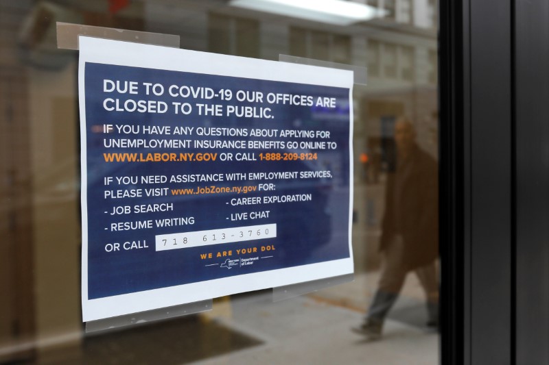 &copy; Reuters. Signage is seen posted on the entrance of the New York State Department of Labor offices, which closed to the public due to the coronavirus disease (COVID-19) outbreak in the Brooklyn borough of New York City