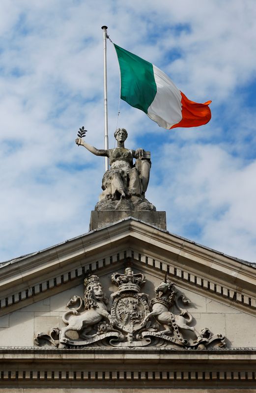 © Reuters. The Irish flag is seen on top of the Bank of Ireland on St. Patrick's Day as public events were cancelled due to the number of coronavirus cases grow around the world