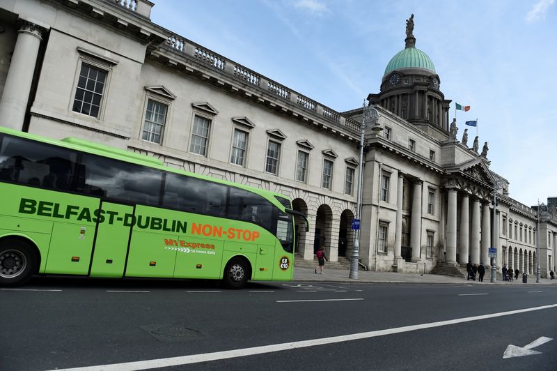&copy; Reuters. A Belfast to Dublin bus is seen outside the Customs House in the Irish Financial Services Centre in Dublin