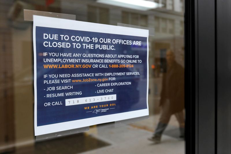 &copy; Reuters. FILE PHOTO: Signage is seen posted on the entrance of the New York State Department of Labor offices, which closed to the public due to the coronavirus disease (COVID-19) outbreak in the Brooklyn borough of New York City