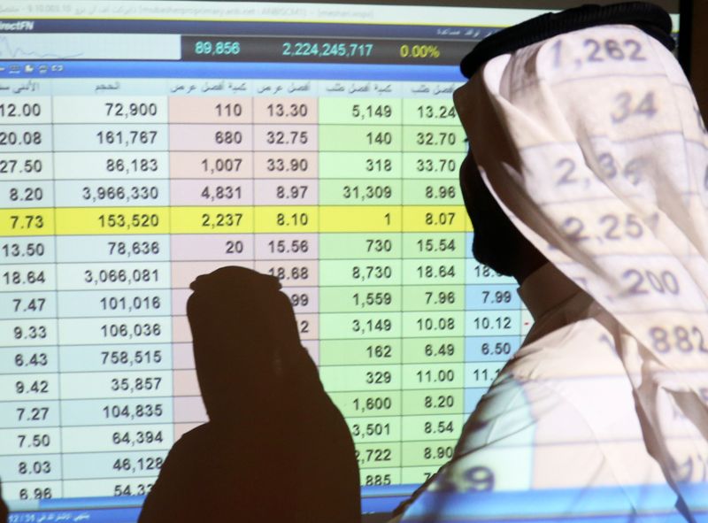 &copy; Reuters. A Saudi man stands in front of a screen of stock prices at ANB Bank in Riyadh