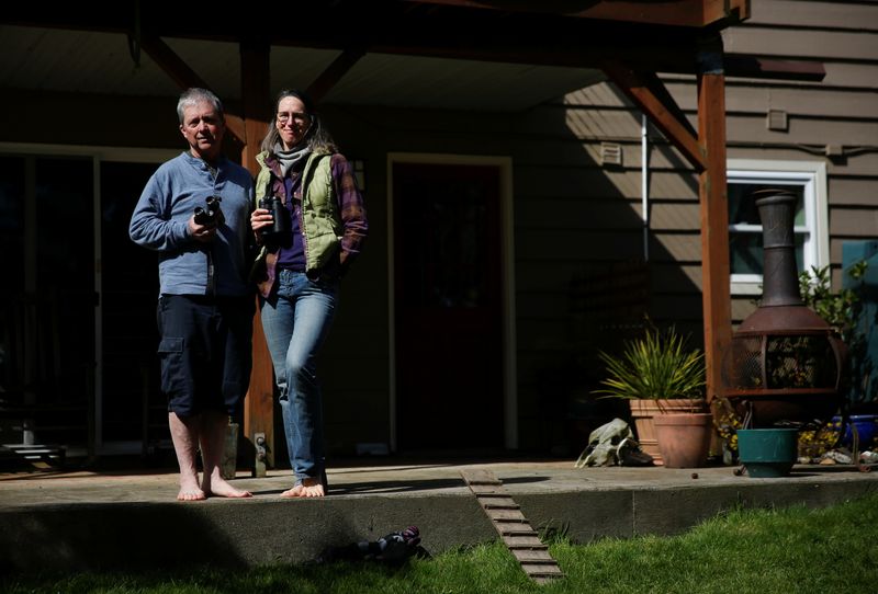 &copy; Reuters. Burrell and husband Seifert, whose home-based business has been shuttered, at their home in Seattle