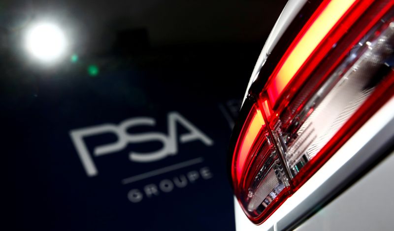 &copy; Reuters. FILE PHOTO: A PSA Group logo is seen behind a car displayed during French carmaker&apos;s news conference as they announce the company&apos;s 2018 results at their headquarters in Rueil-Malmaison