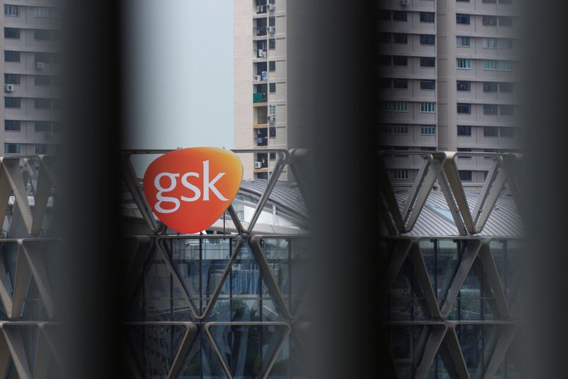 &copy; Reuters. The GSK logo on the facade of GSK Asia House is seen through vertical louvres in Singapore