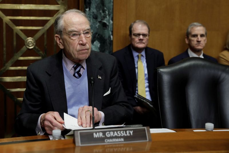 © Reuters. Treasury Secretary Steven Mnuchin testifies before a Senate Finance Committee