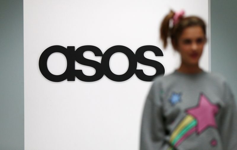 &copy; Reuters. FILE PHOTO: A model walks on an in-house catwalk at the ASOS headquarters in London