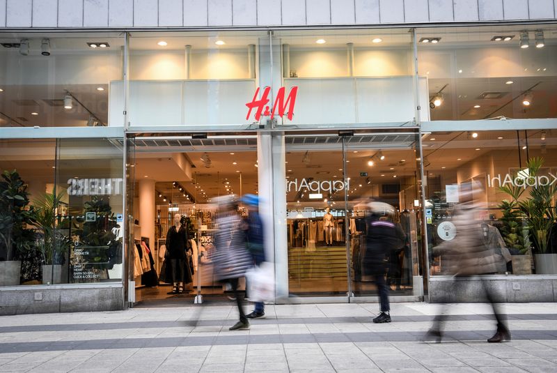 &copy; Reuters. People walk past an H&amp;M store in Stockholm