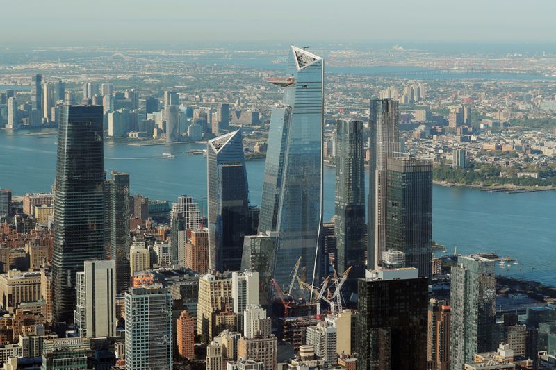 &copy; Reuters. FILE PHOTO: The buildings of Hudson Yards rise above lower Manhattan as seen from an apartment in the Central Park Tower building as the building celebrates its topping out in New York