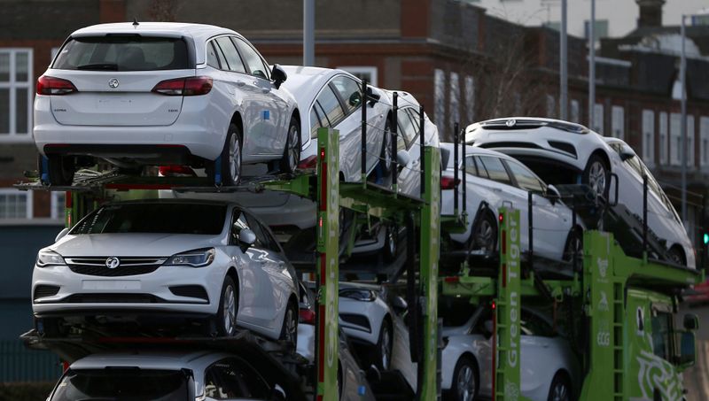 © Reuters. FILE PHOTO: Vauxhall cars are transported on a lorry in Luton, Britain