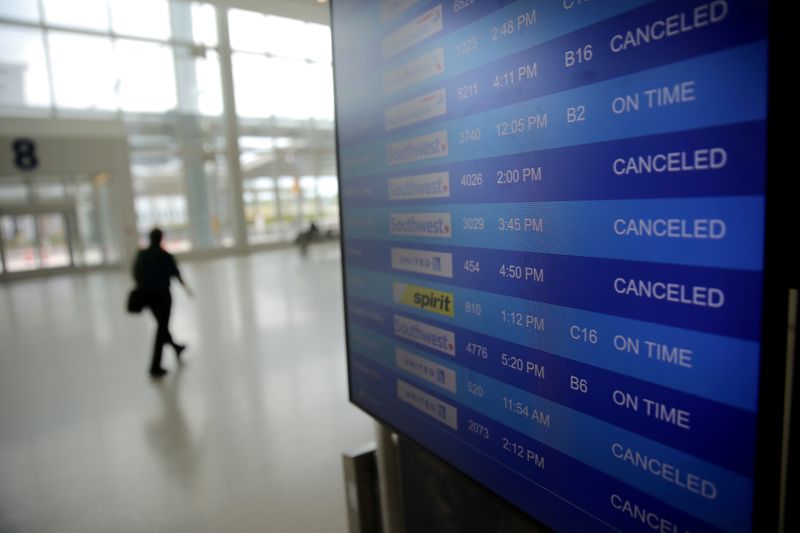 &copy; Reuters. FILE PHOTO: Canceled flights are seen on an airport screen in New Orleans
