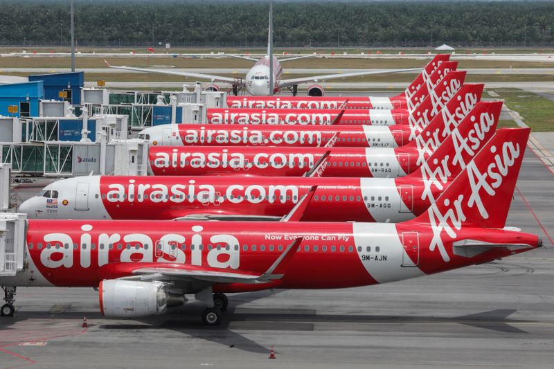 &copy; Reuters. FILE PHOTO:  AirAsia planes are seen parked at Kuala Lumpur International Airport 2, during the movement control order due to the outbreak of the coronavirus disease (COVID-19), in Sepang