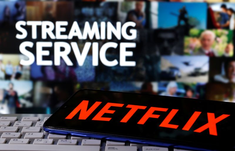 &copy; Reuters. A smartphone with the Netflix logo is seen on a keyboard in front of displayed &quot;Streaming service&quot; words in this illustration