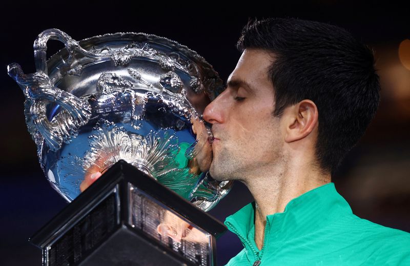© Reuters. Serbia's Novak Djokovic kisses the trophy after winning the Australian Open