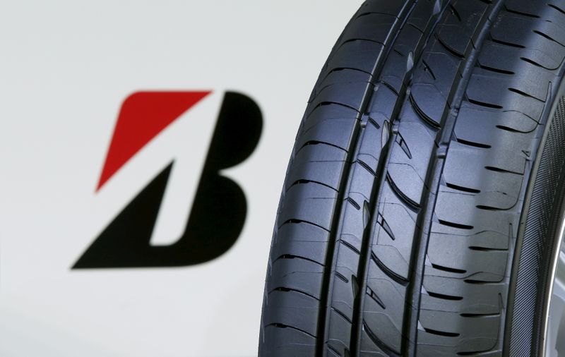 &copy; Reuters. The logo of Bridgestone Corp is seen next to its new Playz tyre during the tyre&apos;s unveiling event in Tokyo