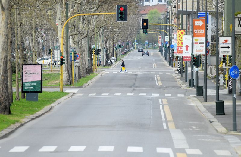 &copy; Reuters. FILE PHOTO: A view shows an almost empty street, during a lockdown against the spread of coronavirus disease (COVID-19) in Milan