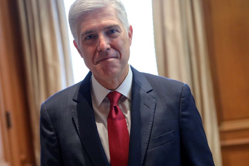 © Reuters. FILE PHOTO: U.S. Supreme Court Justice Neil Gorsuch poses for a picture in his chambers at the Supreme Court building in Washington