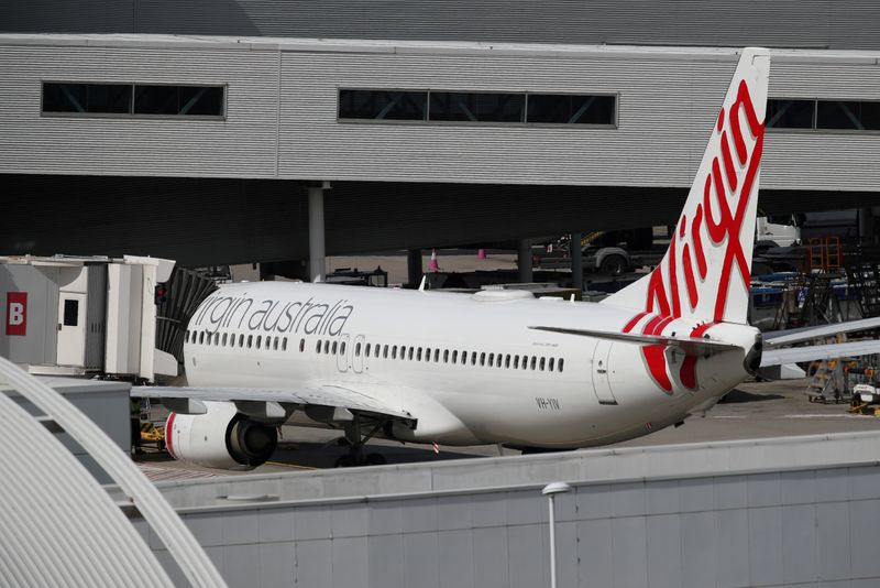 &copy; Reuters. FILE PHOTO: A Virgin Australia plane at Kingsford Smith International Airport after Australia implemented an entry ban on non-citizens and non-residents due to the coronavirus outbreak