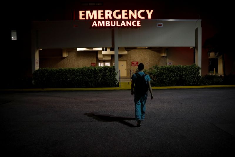 &copy; Reuters. Dennis D&apos;Urso, a resident ER doctor at Holy Cross Hospital, arrives at work for the start of his shift, in Fort Lauderdale