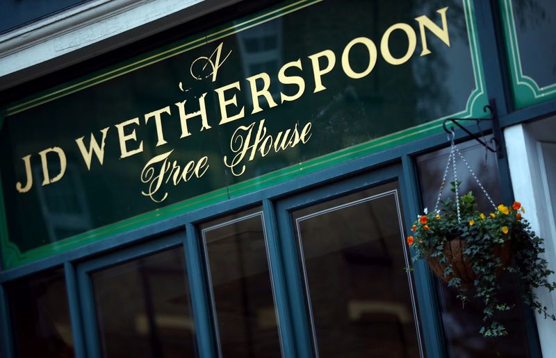 &copy; Reuters. FILE PHOTO: A Wetherspoon&apos;s logo is seen at a pub in central London