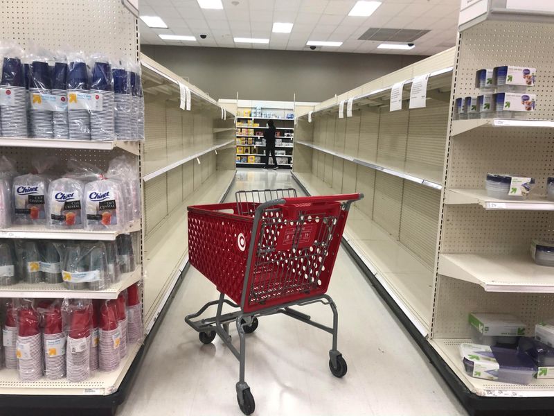 © Reuters. An abandoned shopping cart lies between empty paper towel aisles at a Target store in Culver City