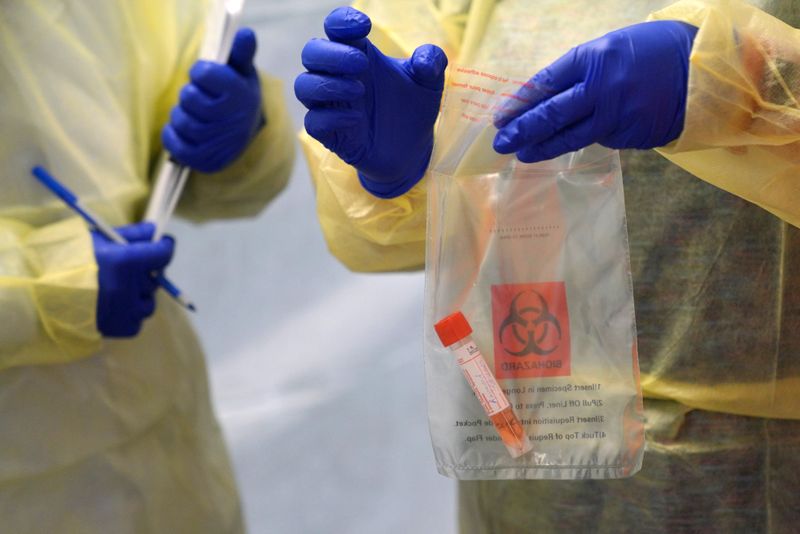 &copy; Reuters. Provincial health workers perform coronavirus disease tests in Gull Bay